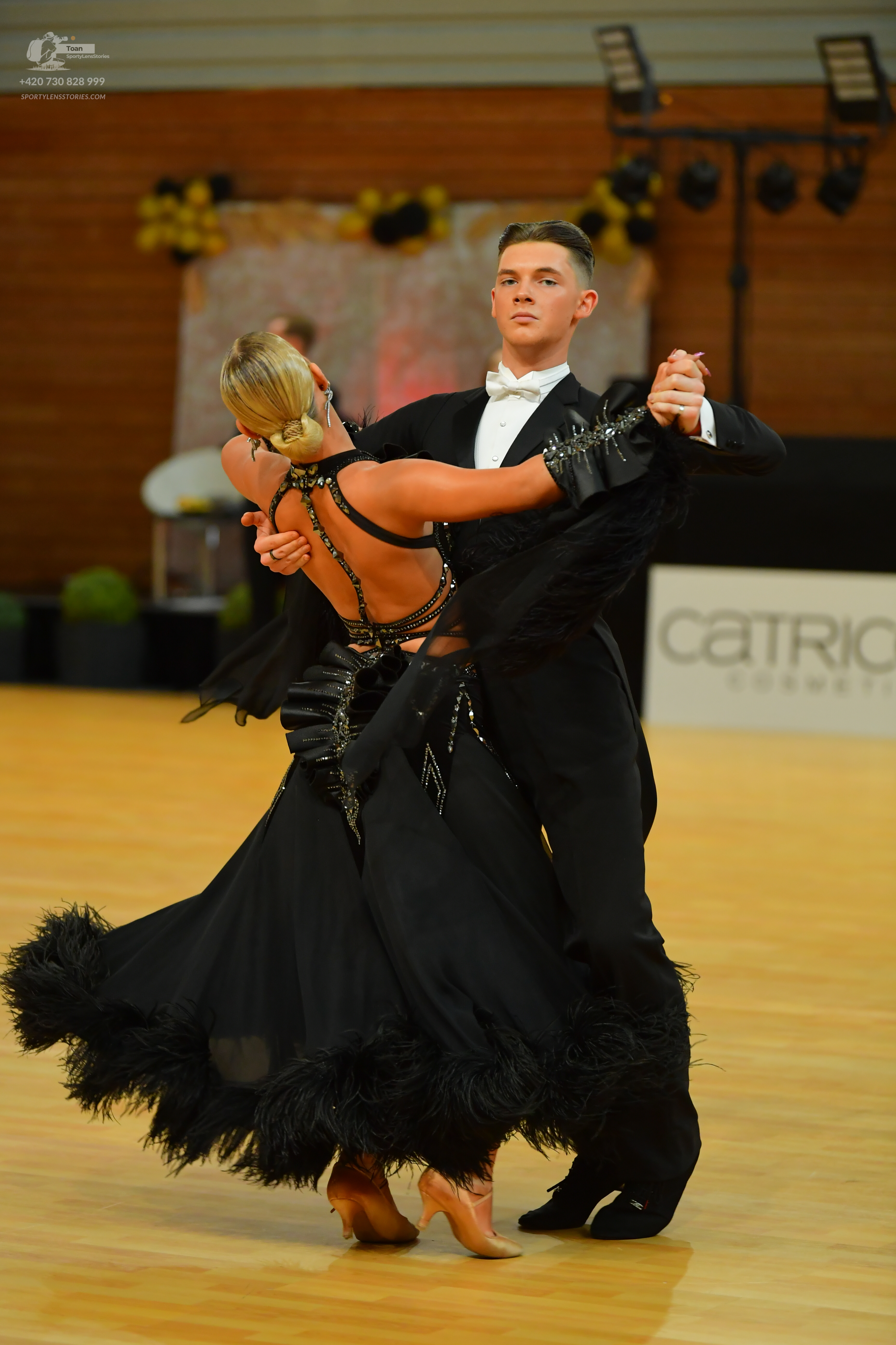Dancesport competitor: ** Male: Black tail suit made of satin with black sequin lapels