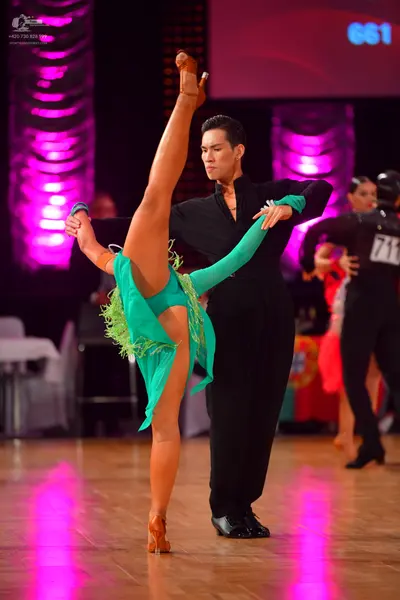 Dancesport competitor #711: Male dancer: black long-sleeved shirt and black trousers