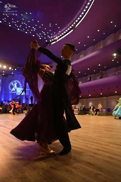 Dancesport competitor: Main male dancer: black ballroom tailcoat and trousers