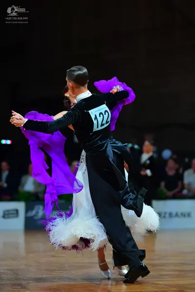 Dancesport competitor #122: Male dancer: black long-sleeved top and black trousers