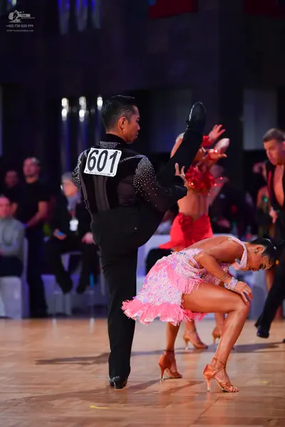 Dancesport competitor #601: Male dancer: black long-sleeved shirt with sequins and black trousers