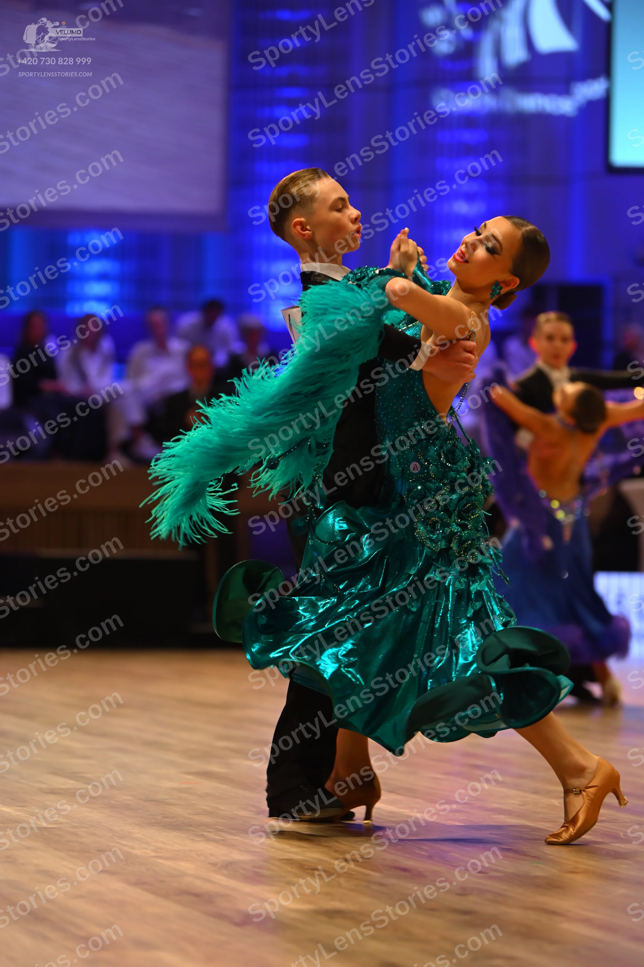 Dancesport competitor: Male dancer: black suit with a white shirt and black bow tie