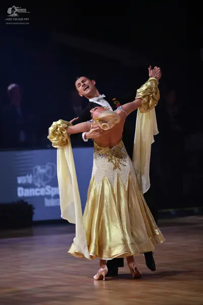 Dancesport competitor: Male dancer: black suit with a white shirt and white bowtie
