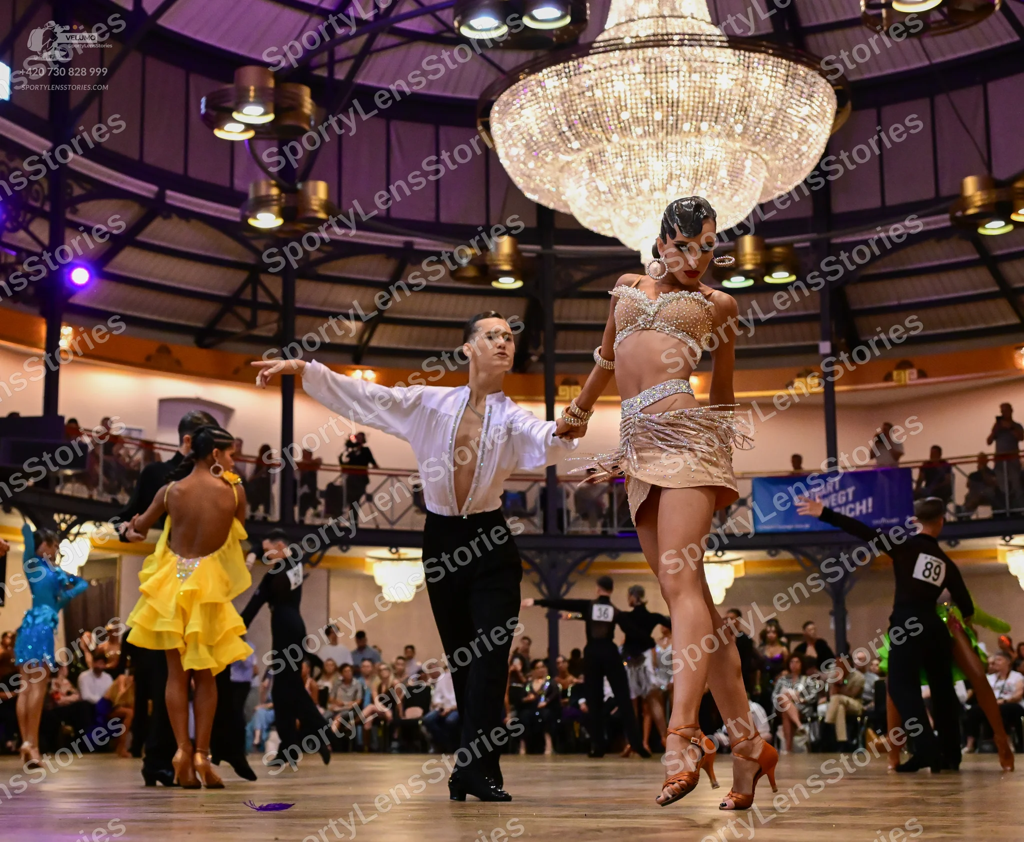 Dancesport competitor #89: Male dancer (center): white long-sleeved shirt and black trousers
