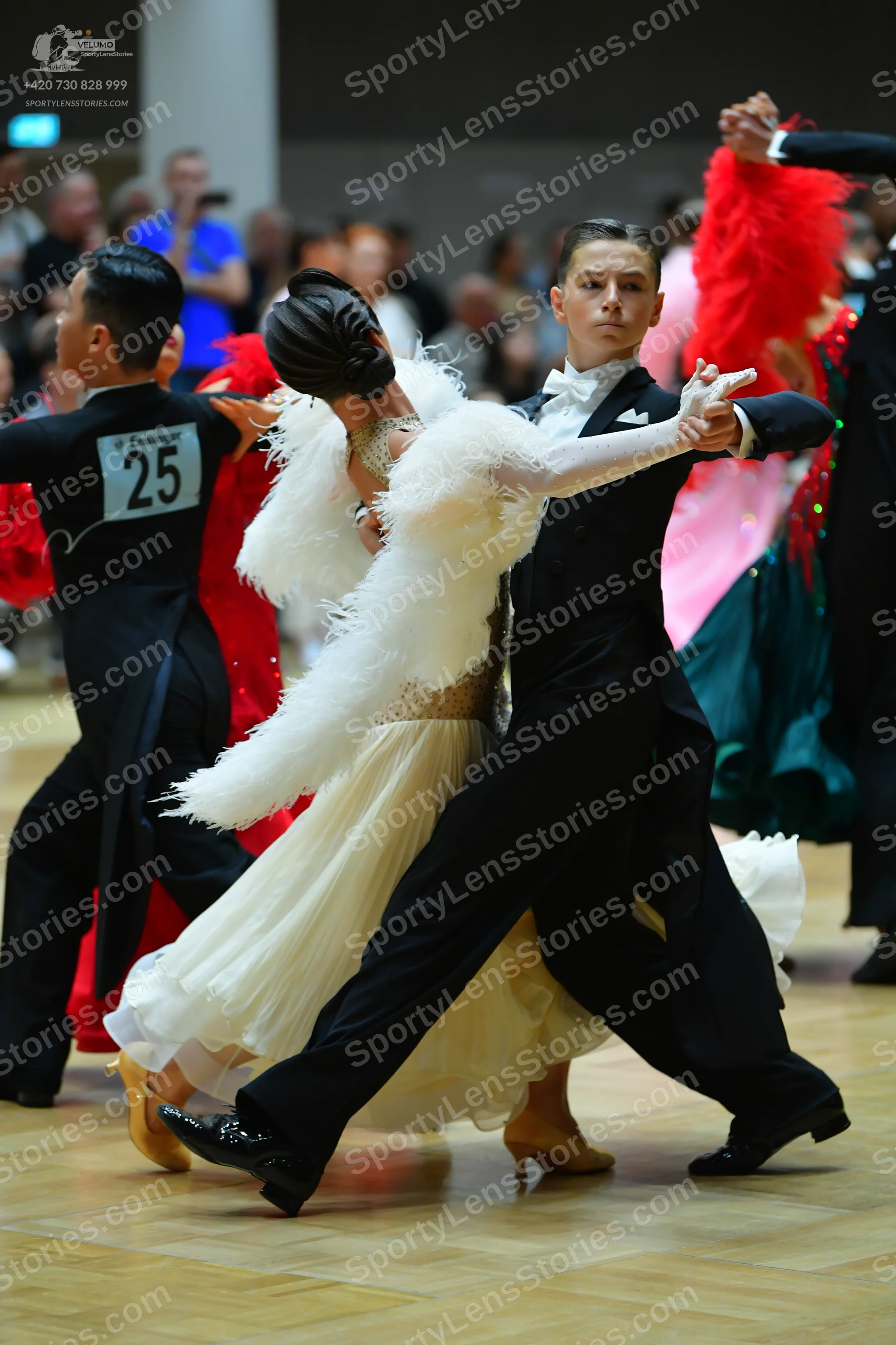 Dancesport competitor #25: Male dancer (left): black suit