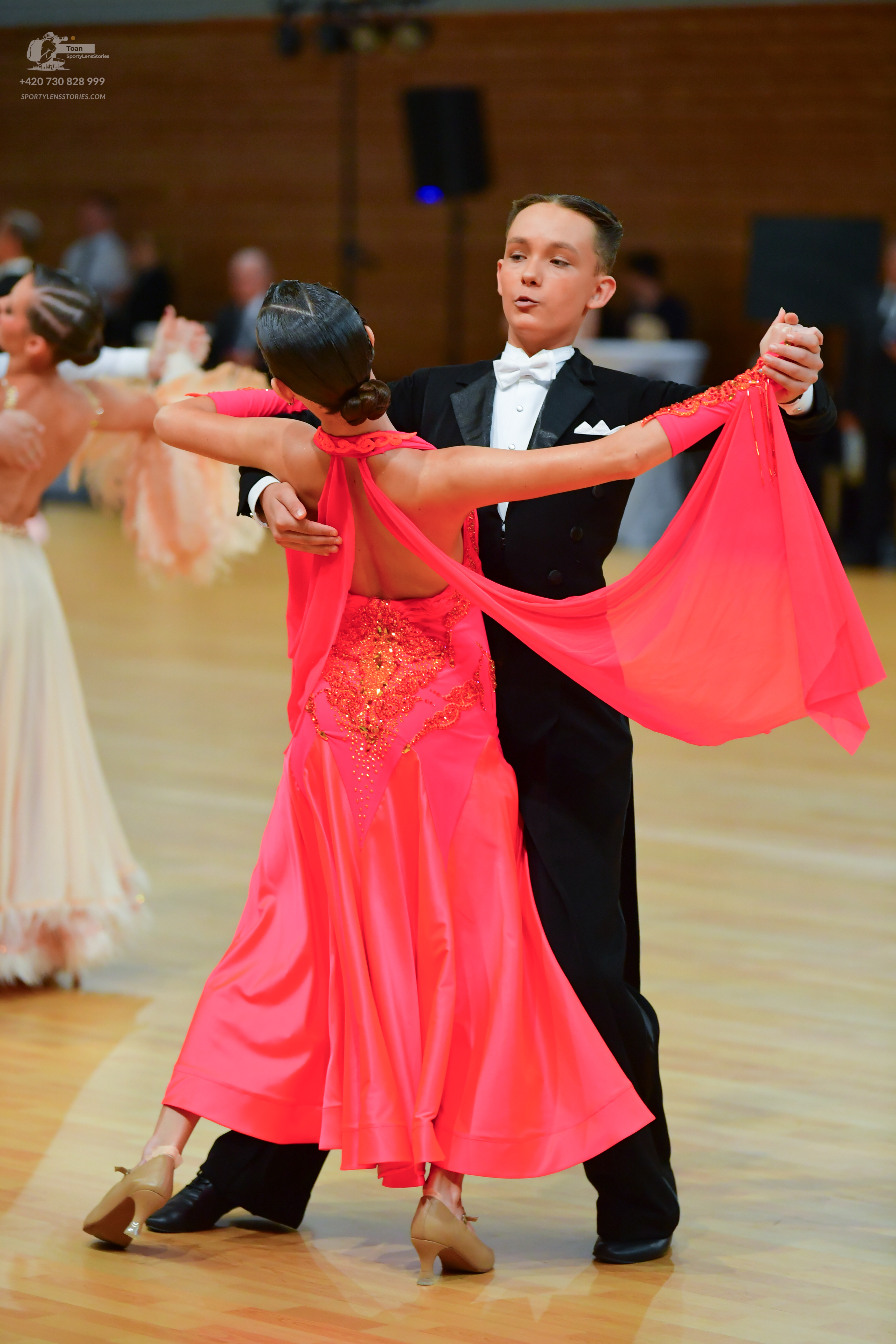 Dancesport competitor: Male** 
*   **Color:** Black
*   **Fabric:** Satin (likely with sequin detailing