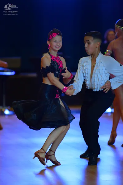 Dancesport competitor: ** Black suit with sequin lapels