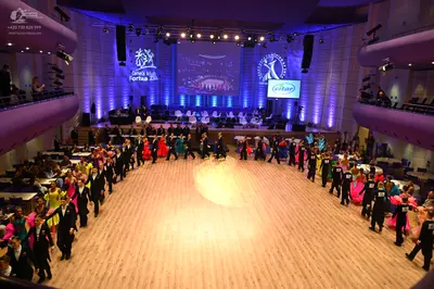 Dancesport competitor: Male dancers: black suits or tuxedos, often paired with white shirts