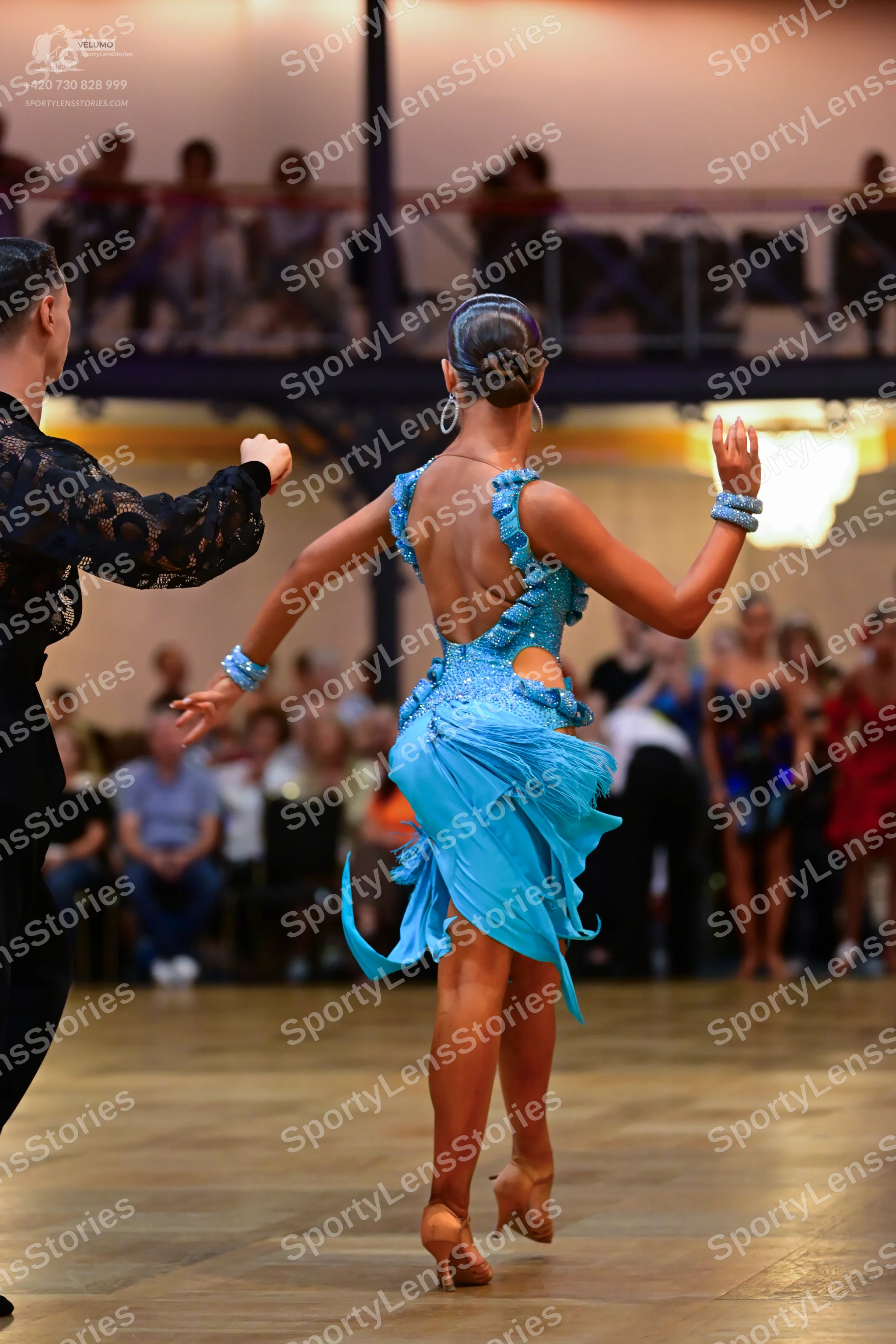 Dancesport competitor: Male dancer: black long-sleeved shirt with lace-patterned sleeves and black trou