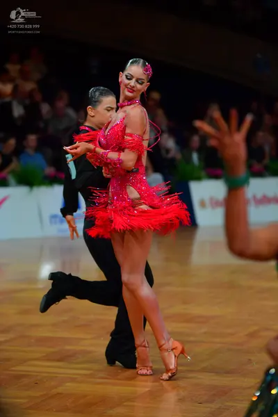 Dancesport competitor: Male dancer: black long-sleeved shirt and black trousers