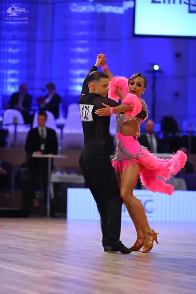 Dancesport competitor: Male dancer: black long-sleeved shirt and black trousers