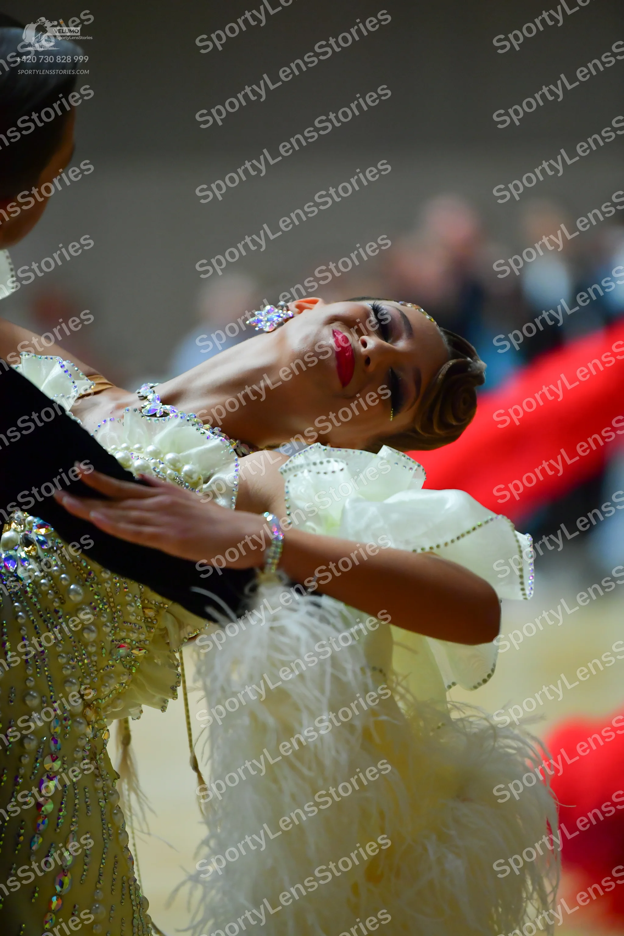 Dancesport competitor: Male dancer: black garment with some sequin detail visible on the shoulder