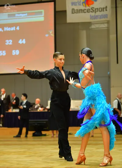 Dancesport competitor: Male dancer: black long-sleeved shirt and black trousers