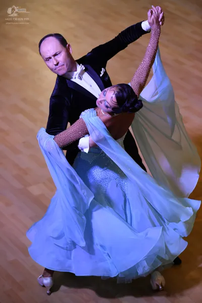 Dancesport competitor: **

**Male:** Black suit with a wide, sequined lapel and matching trousers