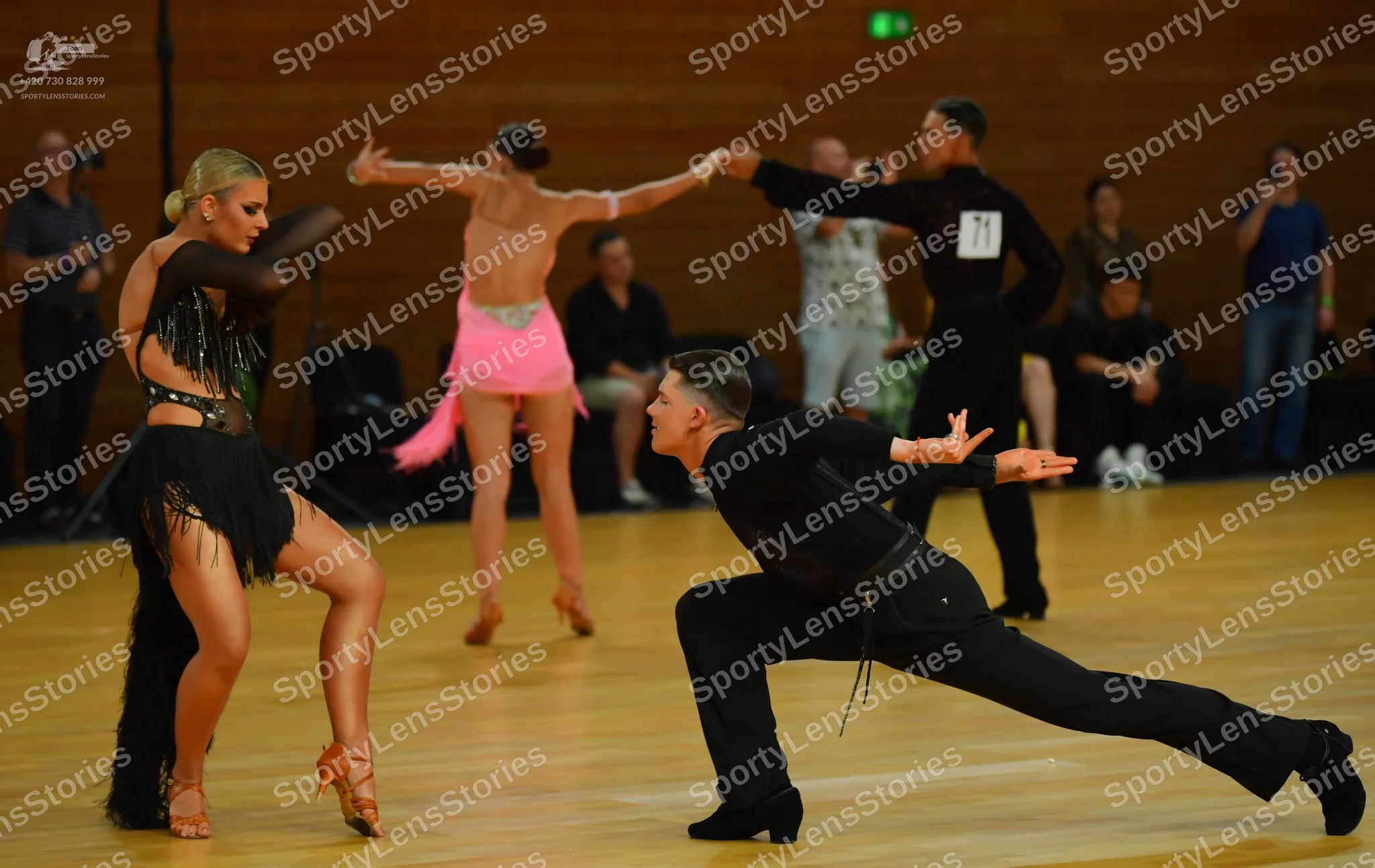 Dancesport competitor: ** Red Latin Dress
*   **Color:** Predominantly red