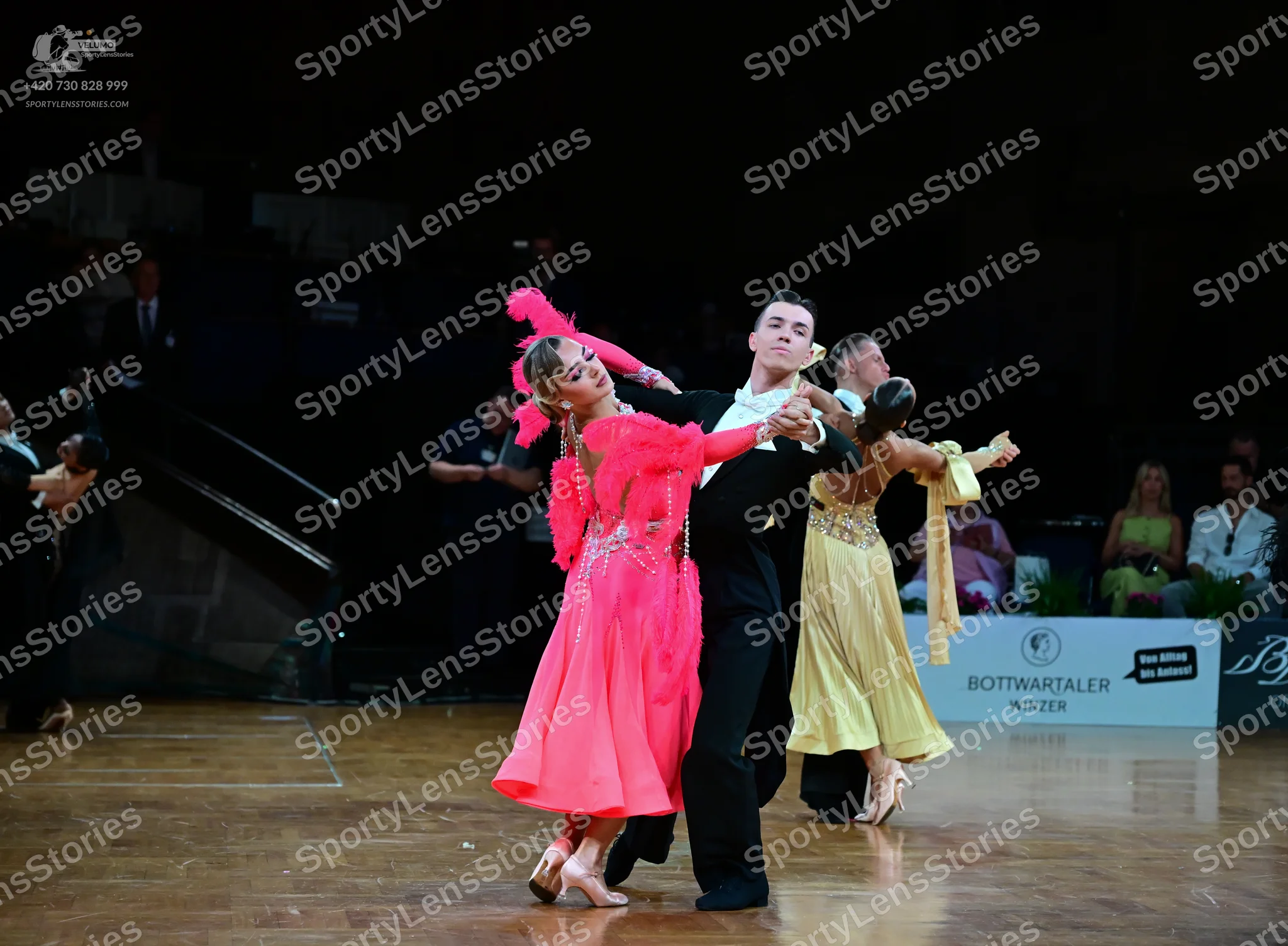 Dancesport competitor: Female dancer: pink Latin dress with lace bodice and a flowy skirt