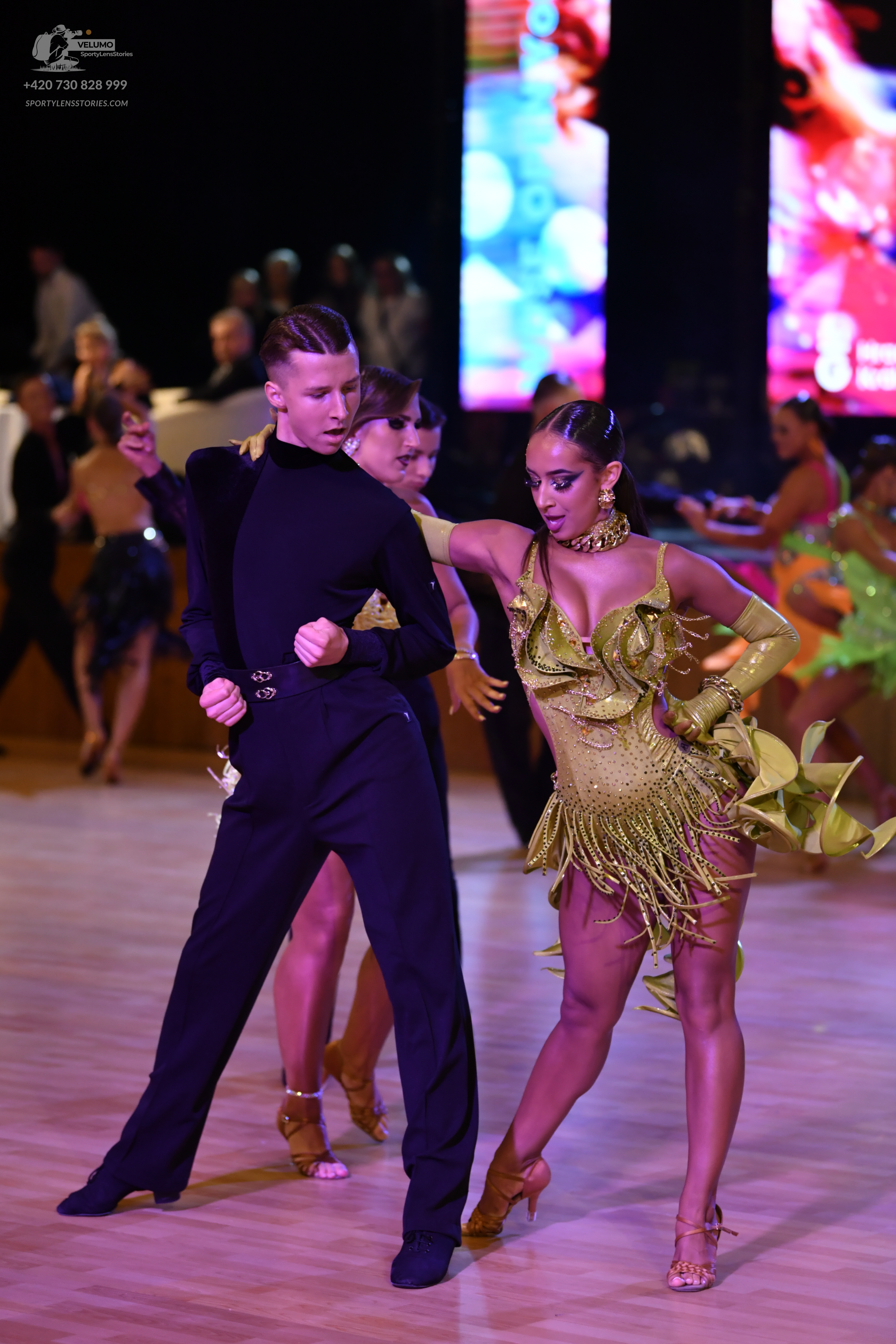 Dancesport competitor: ** Black tailsuit with sequin lapels