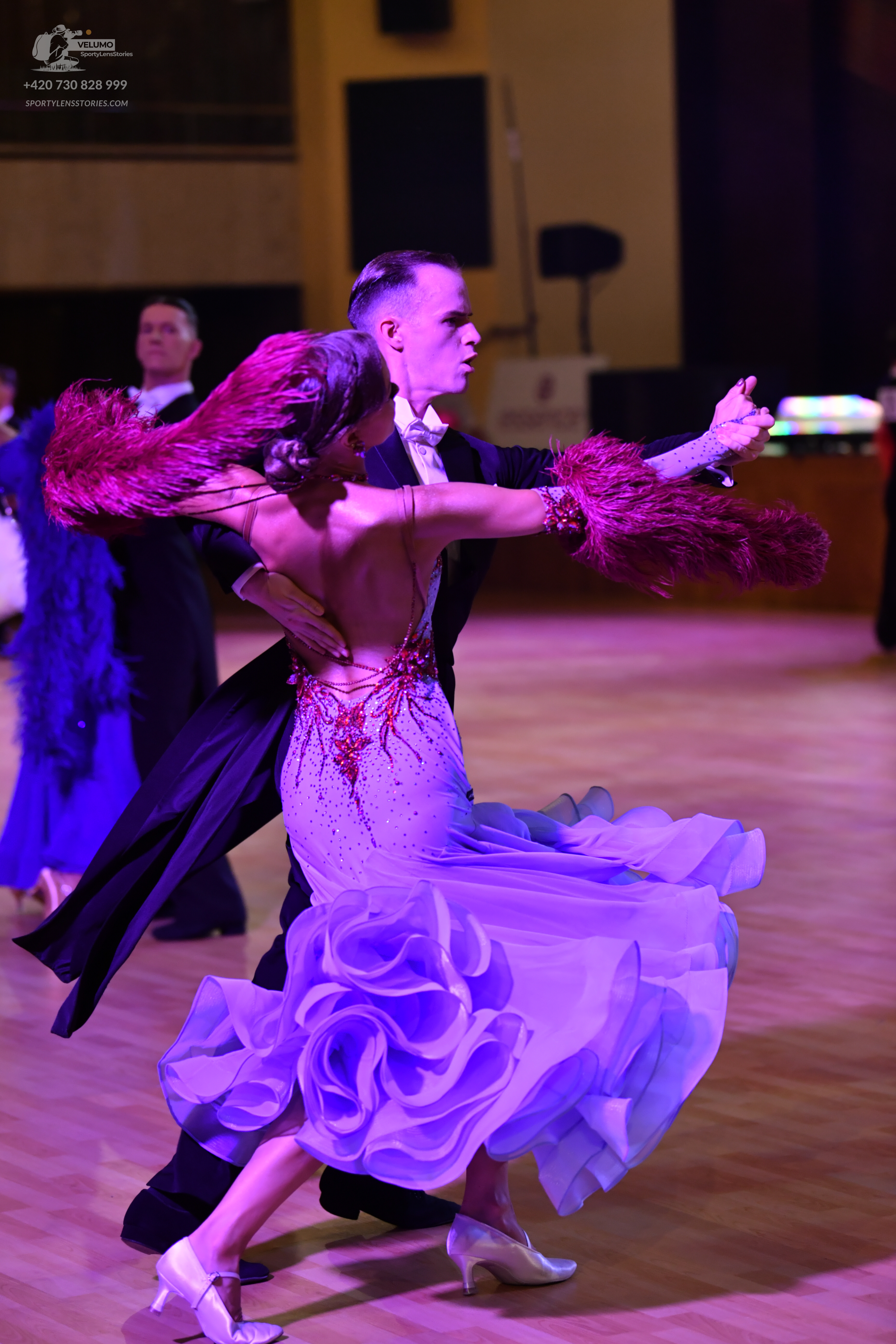 Dancesport competitor: Male dancer: black tuxedo with a white shirt and black bow tie