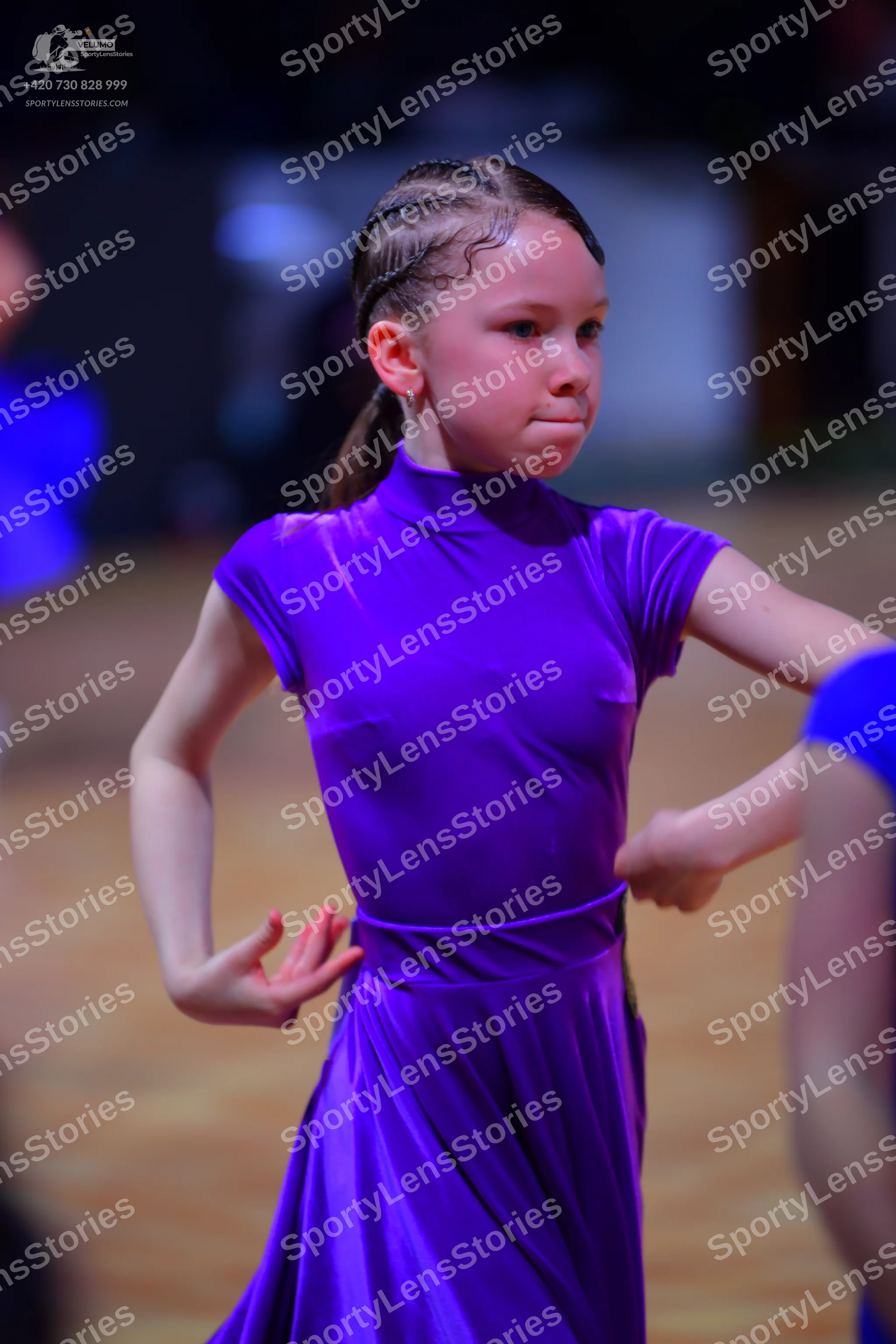 Dancesport competitor: Female dancer: purple, short-sleeved, high-neck ballroom dress with a long skirt