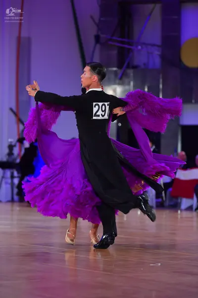 Dancesport competitor #297: Male dancer: black long-sleeved shirt and black trousers
