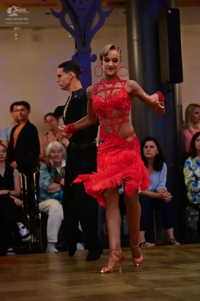 Dancesport competitor: Male dancer: black long-sleeved dance shirt and black trousers