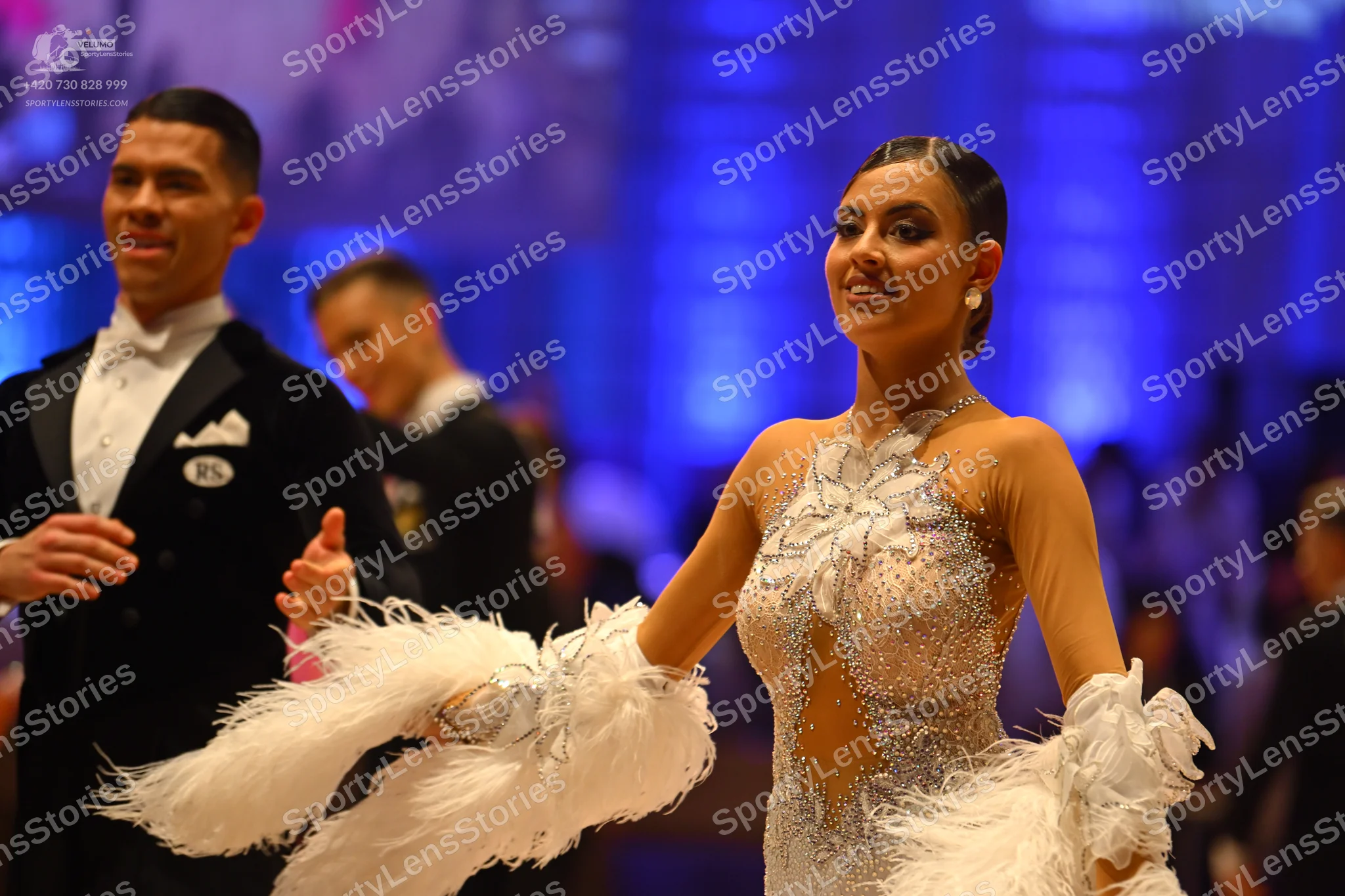 Dancesport competitor: Male dancer: black suit with a white shirt and white bow tie