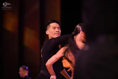 Dancesport competitor: ** Black Tail Suit
*   **Fabric:** Sequined
*   **Style:** Tailored suit, mimick