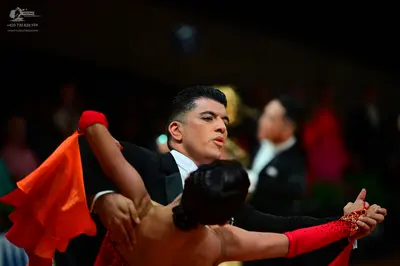 Dancesport competitor: Male dancer: black suit