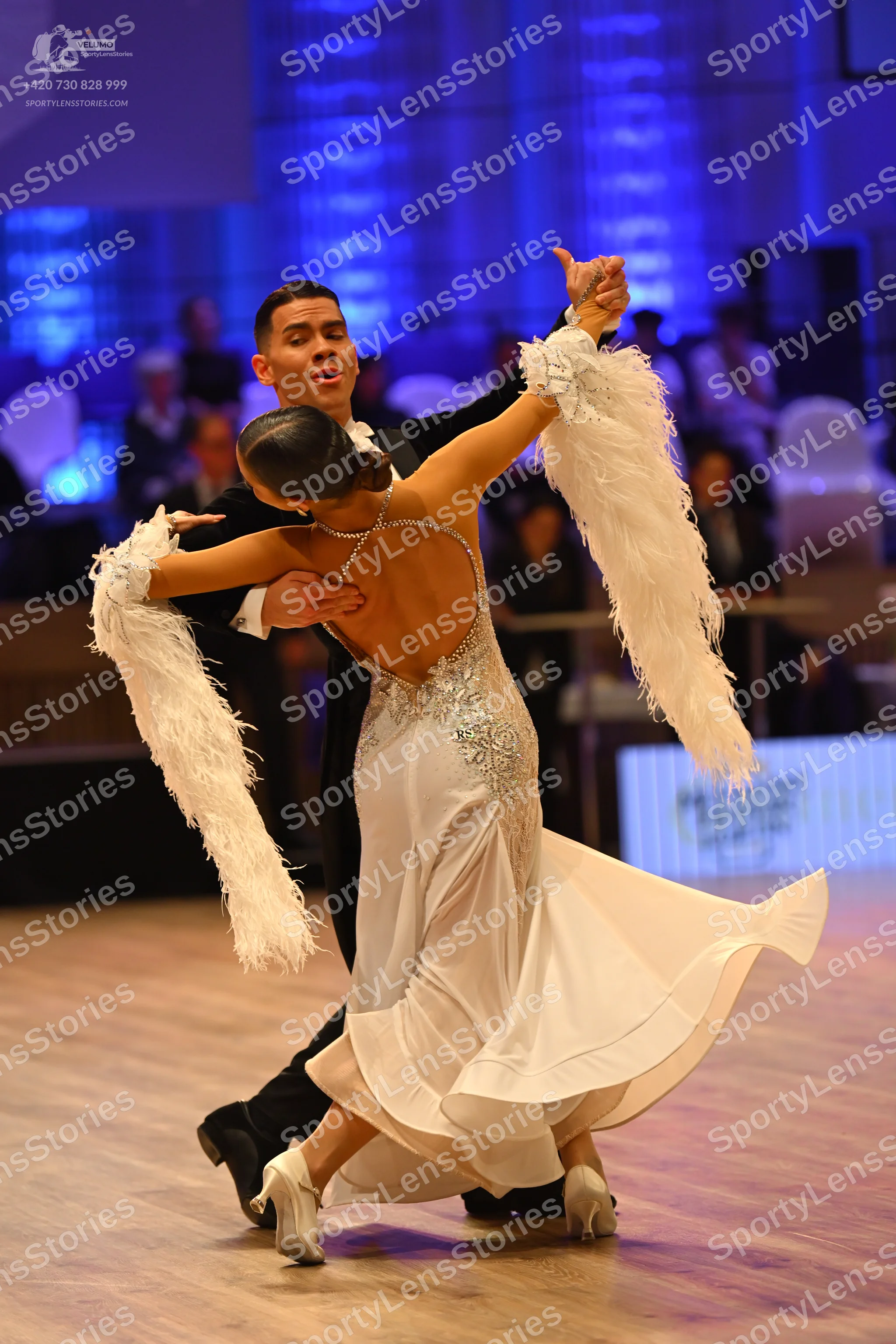 Dancesport competitor: Male dancer: black suit with a white shirt and black bow tie