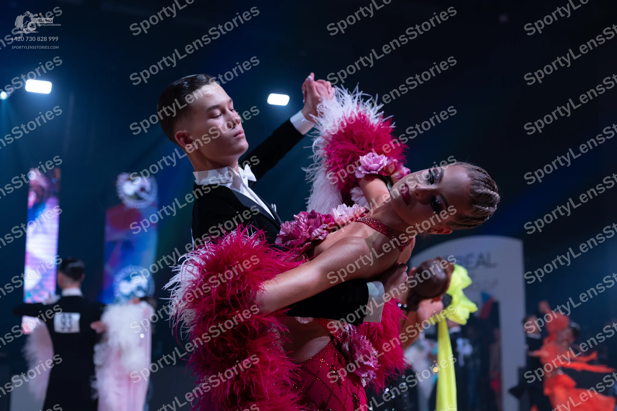 Dancesport competitor: Male dancer: black suit with a white shirt and white bowtie