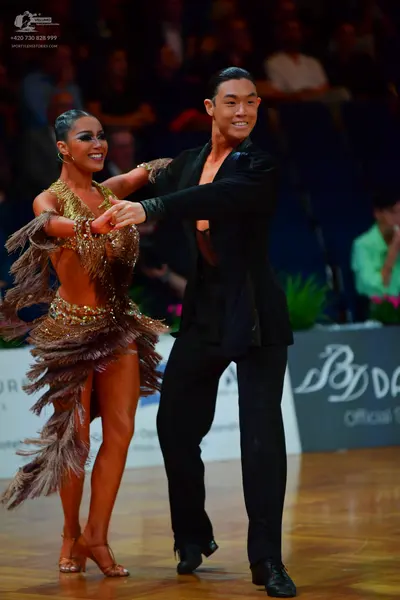 Dancesport competitor: Male dancer: black suit