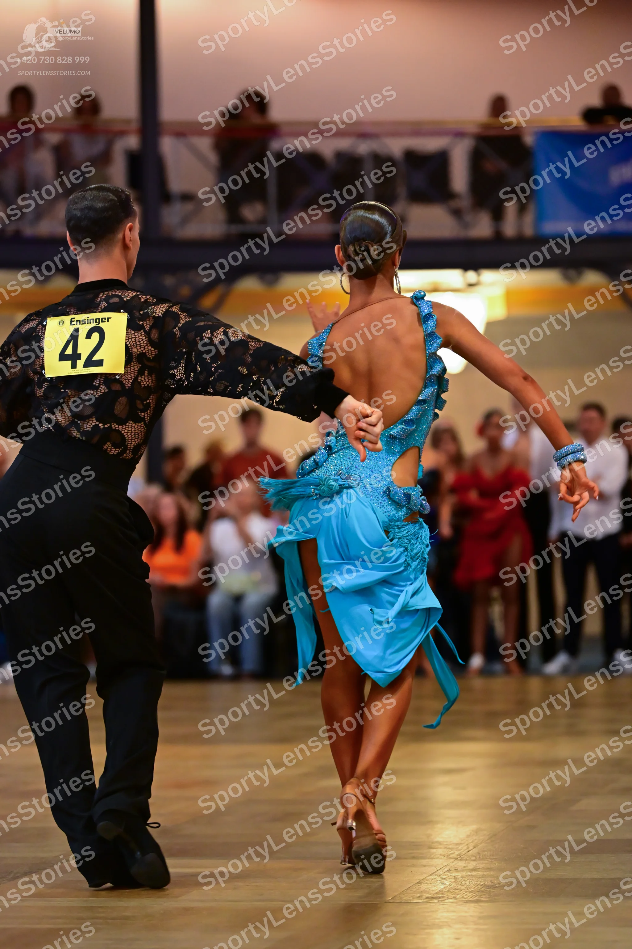 Dancesport competitor #42: Male dancer: black long-sleeved shirt with a lace pattern and black trousers