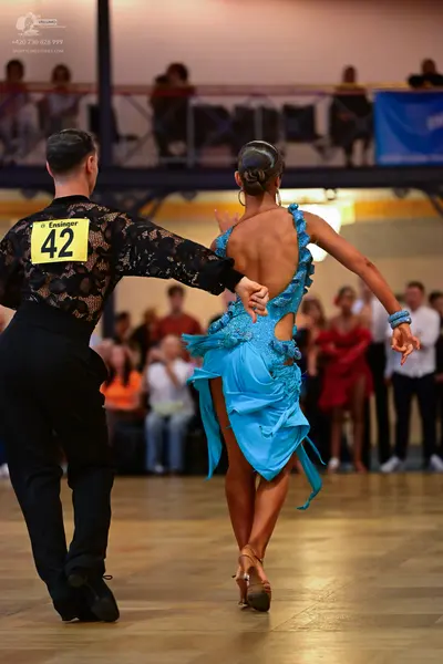 Dancesport competitor #42: Male dancer: black long-sleeved shirt with a lace pattern and black trousers