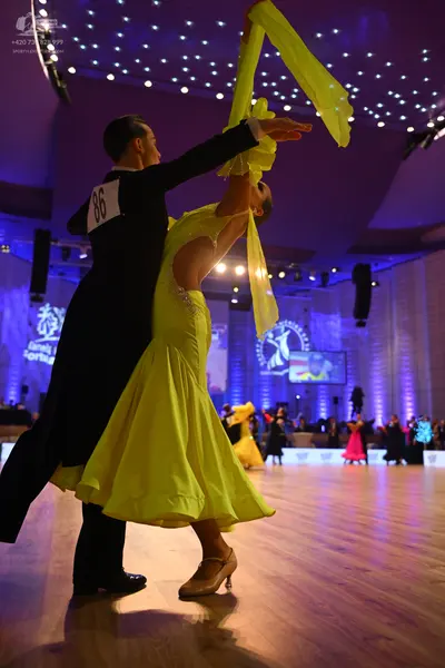 Dancesport competitor: Male dancer: black suit