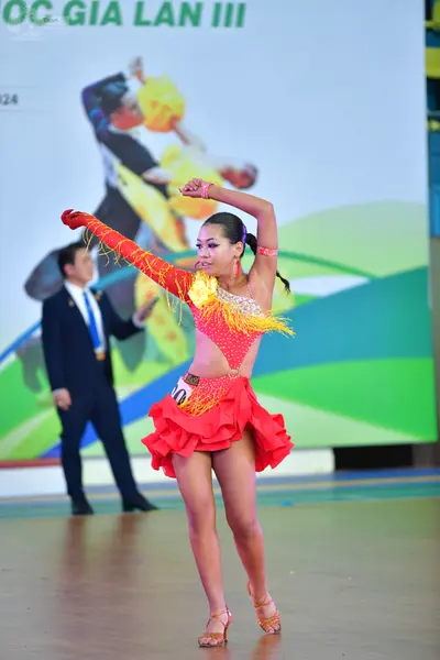 Dancesport competitor: ** Red Latin dress
*   **Fabric:** Satin (appears to be a textured satin)
*   **