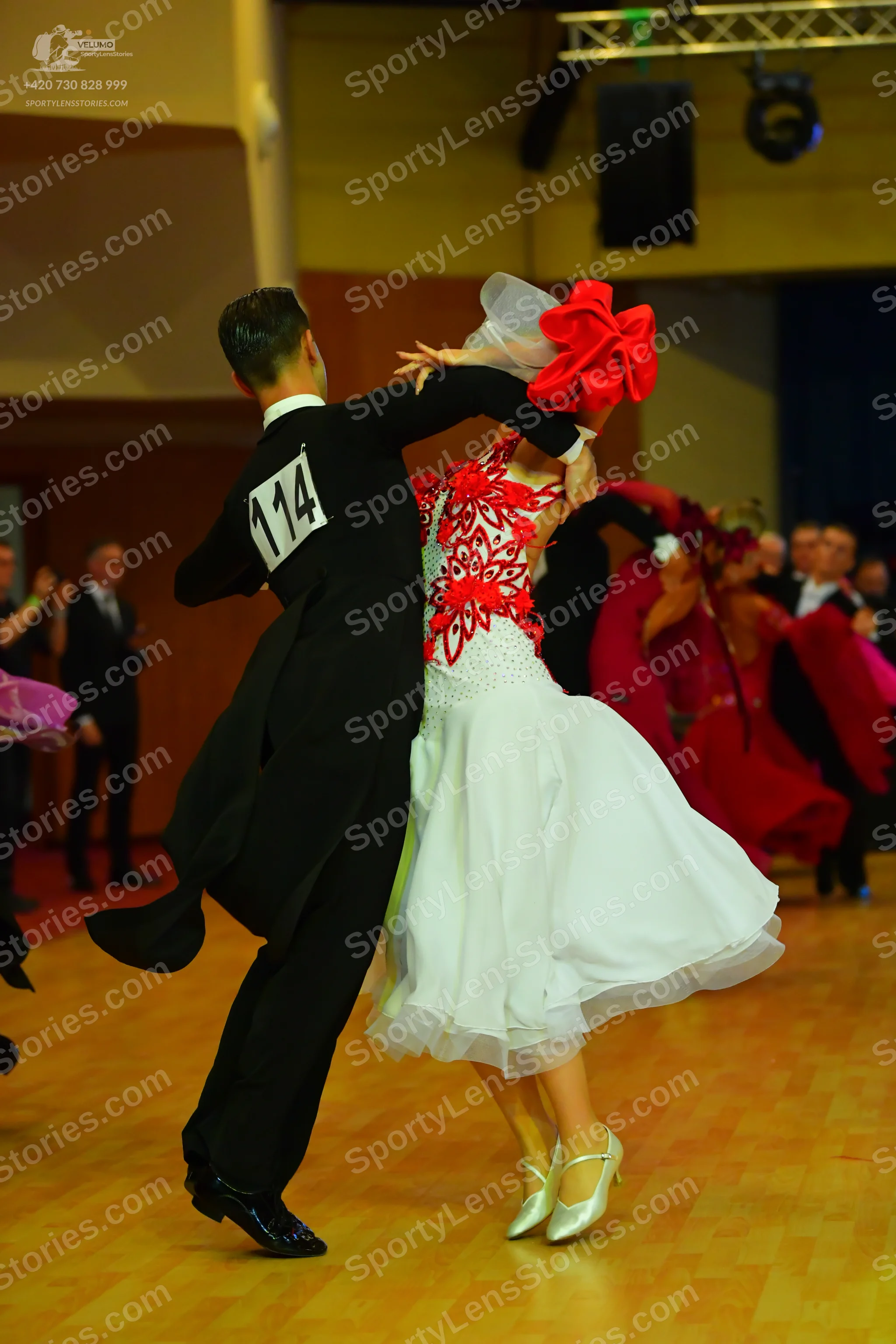 Dancesport competitor #114: Male dancer: black tailcoat, black trousers, and black dance shoes