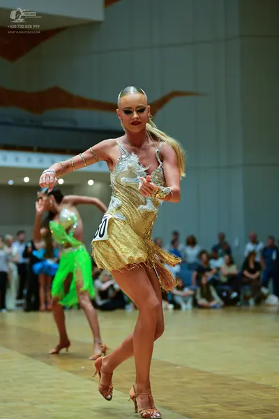 Dancesport competitor #30: Female dancer in foreground: gold sequin latin dance dress with thin straps, fri