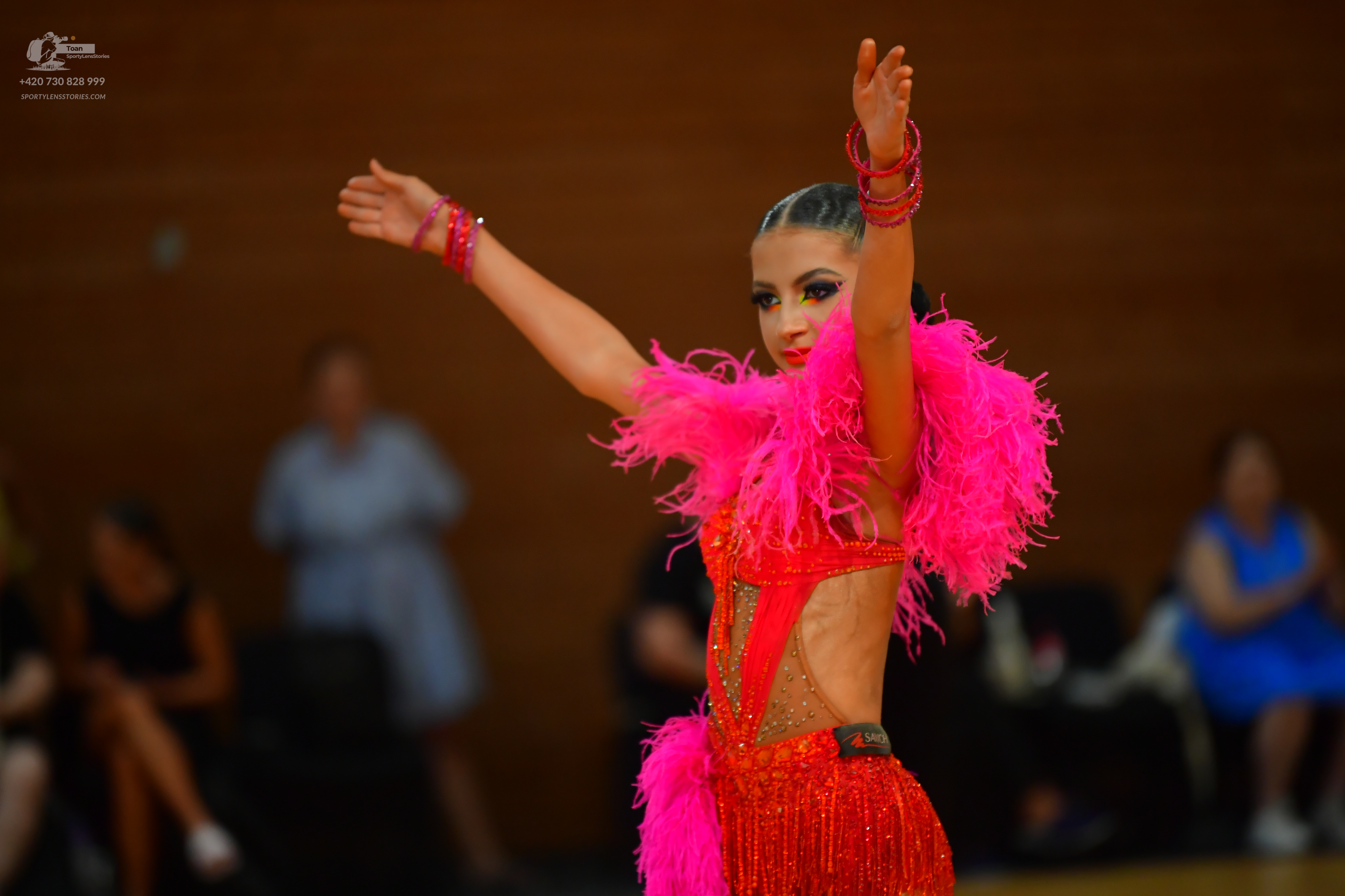 Dancesport competitor: ** Red latin dress with a high slit