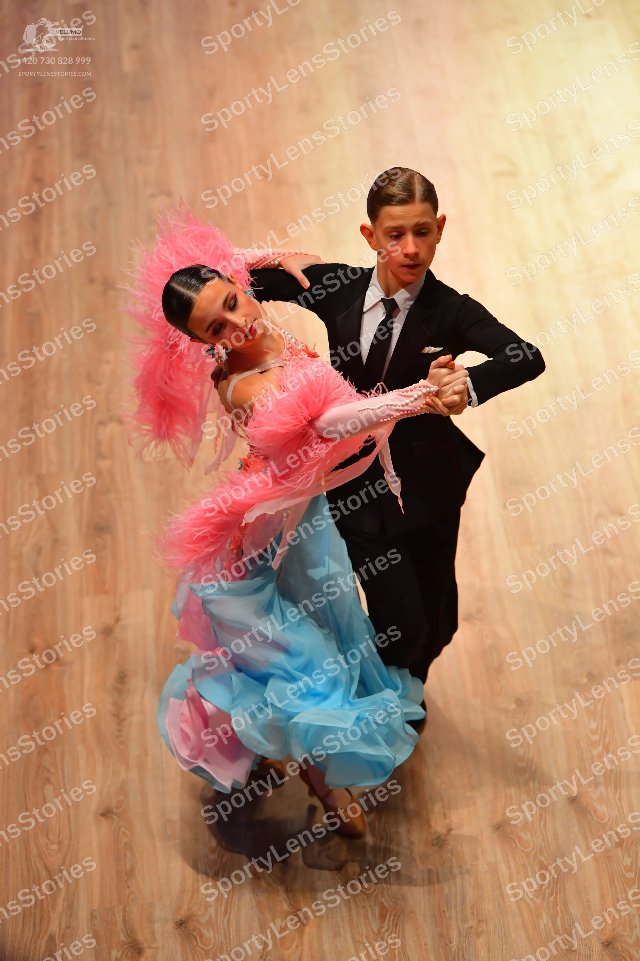 Dancesport competitor: Male dancer: black suit with a white shirt and black tie