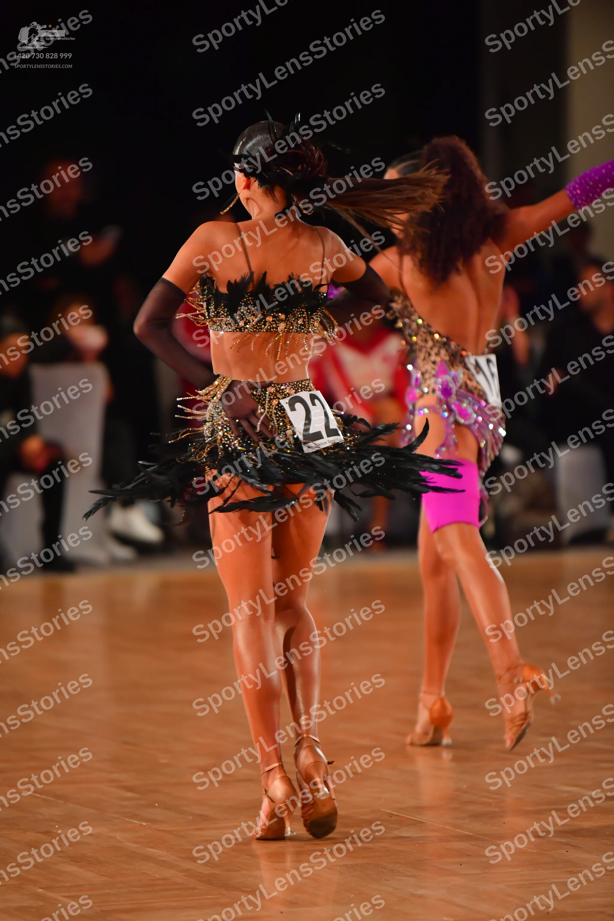Dancesport competitor #22: Female dancer 1: gold and black sequined Latin dance costume with black fringe/f