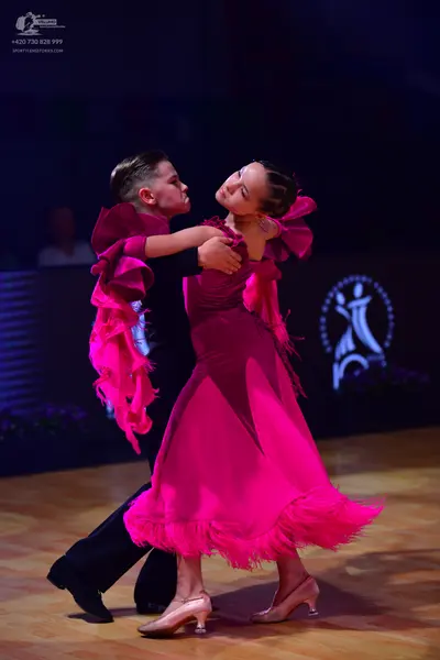 Dancesport competitor: Male dancer: black long-sleeved shirt and black trousers