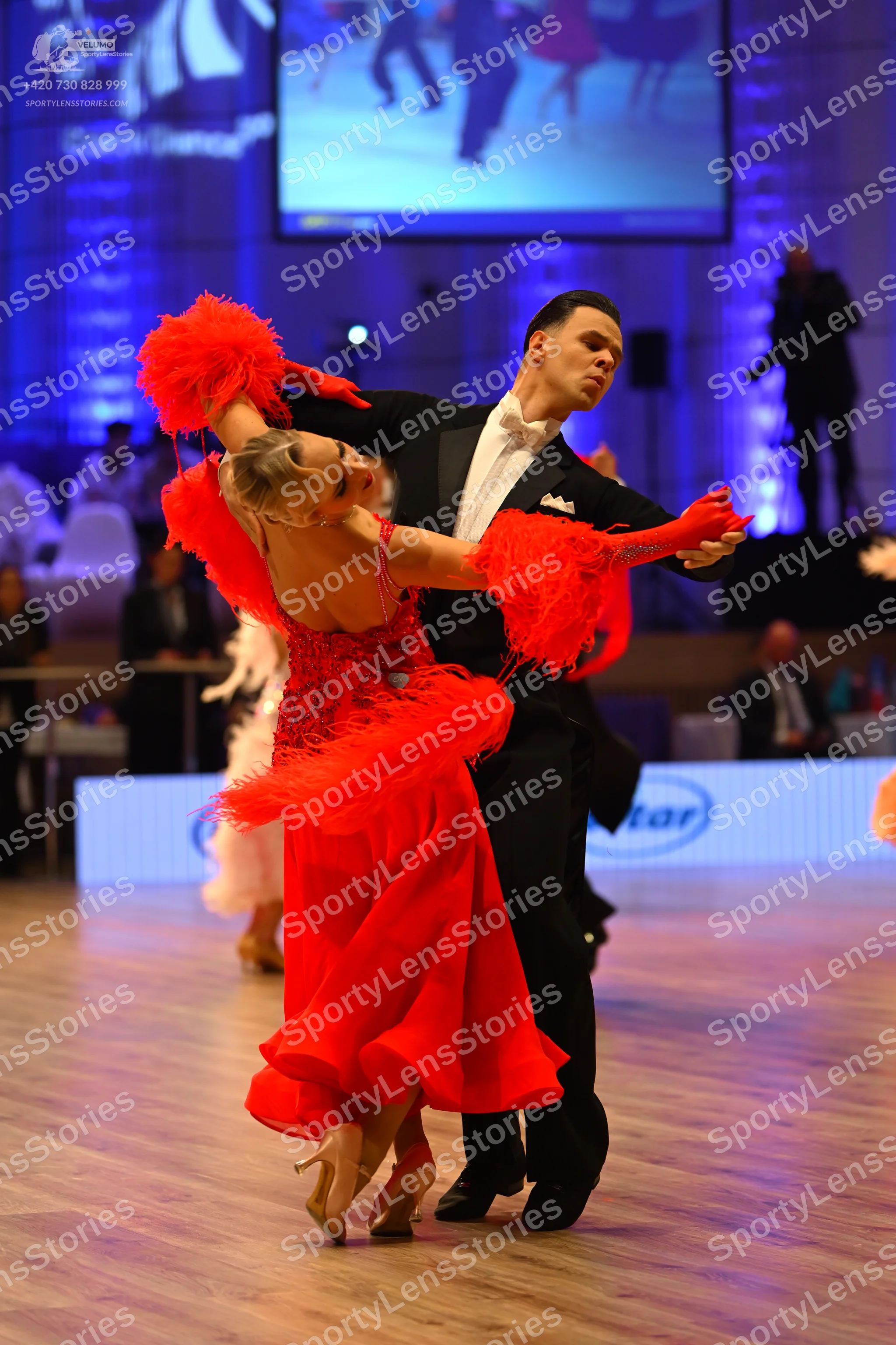 Dancesport competitor: Male dancer: black suit with a white shirt and white bowtie