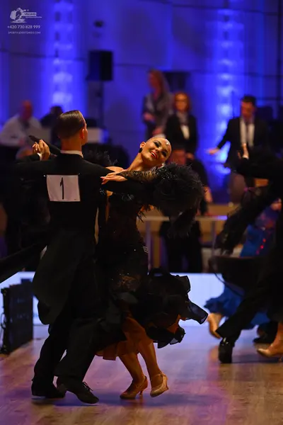 Dancesport competitor: Male dancer: black ballroom suit