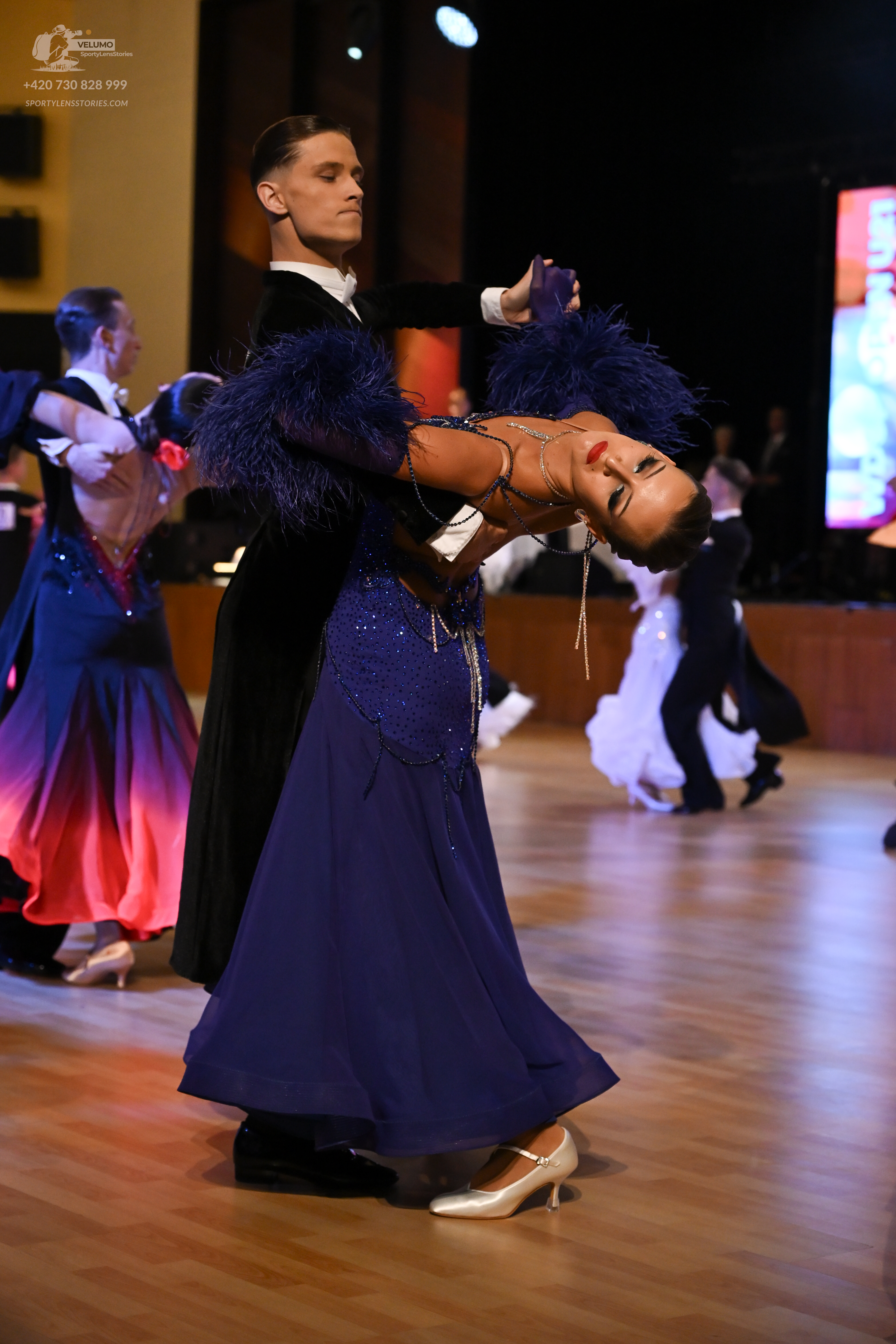 Dancesport competitor: ** Black tail suit with subtle white sequin detailing on the lapels and sleeves