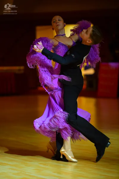 Dancesport competitor: Male dancer: black long-sleeved top and black trousers
