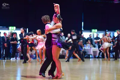 Dancesport competitor #109: Man in foreground: black trousers and white shirt