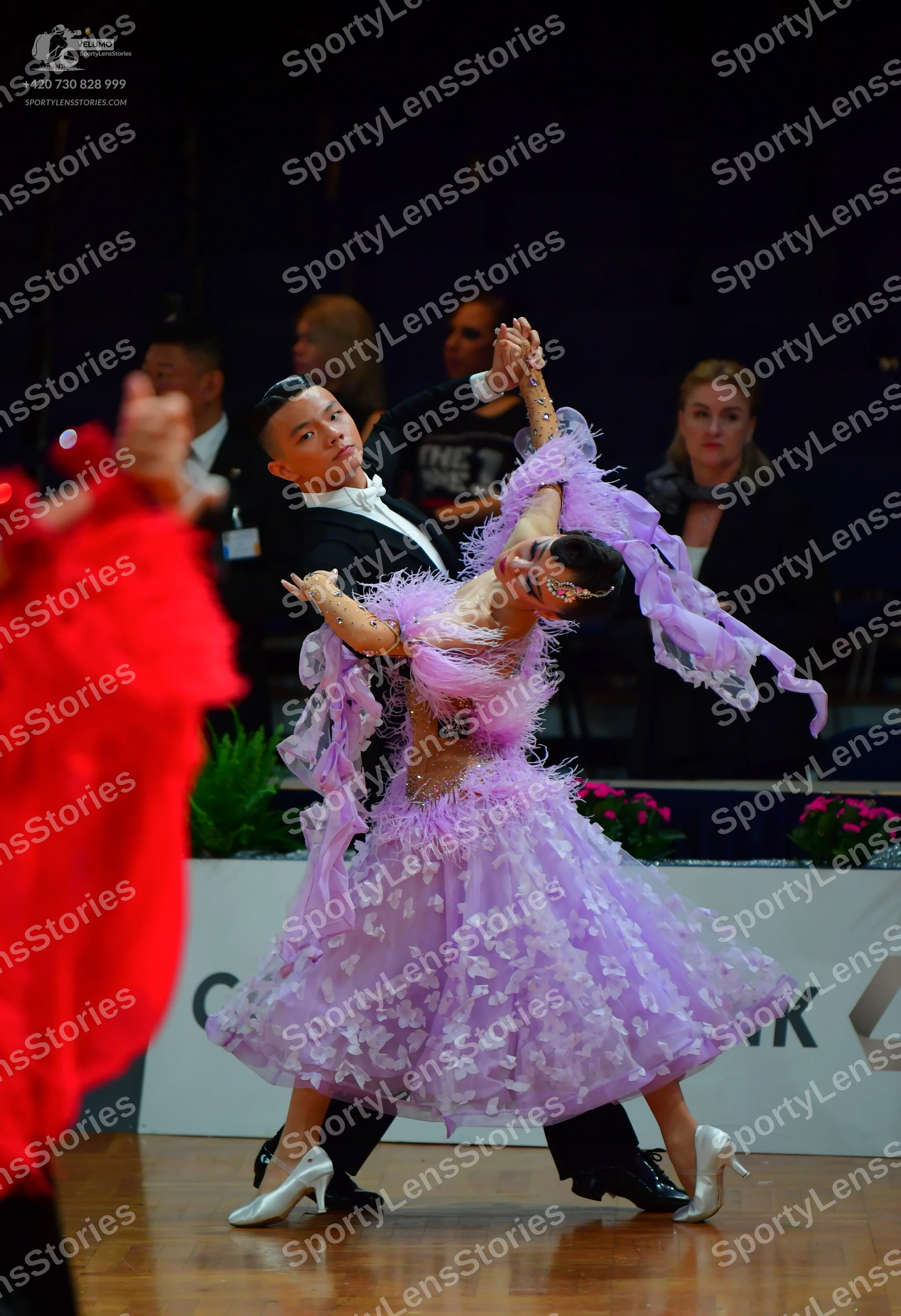 Dancesport competitor: Male dancer: black suit with a white shirt and white bow tie