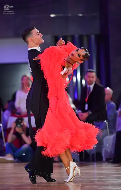 Dancesport competitor: Male dancer: black suit with white shirt