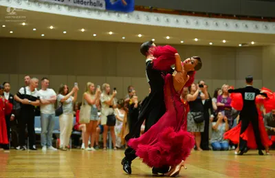 Dancesport competitor: Male dancer: black suit
