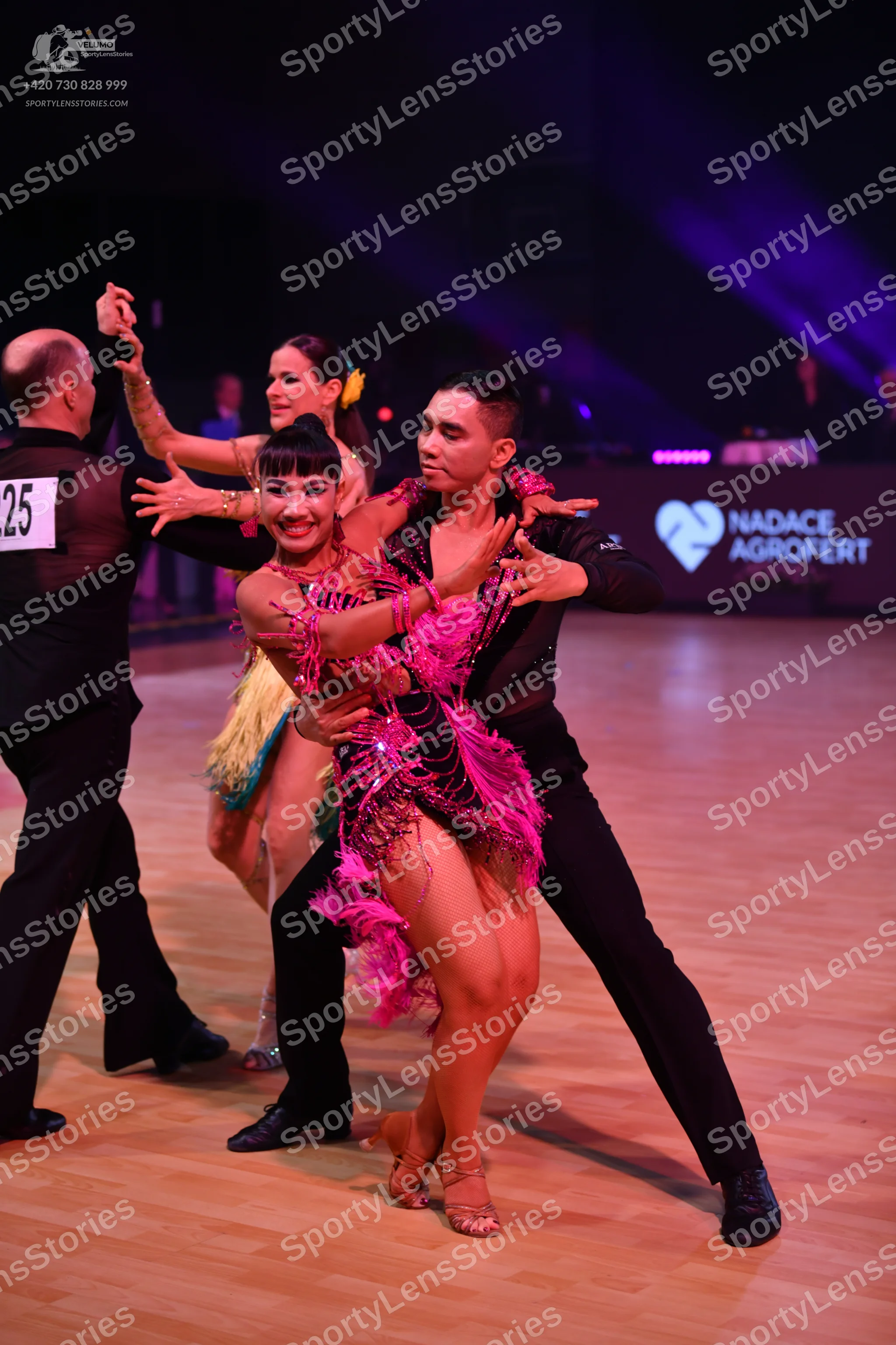 Dancesport competitor: Male dancer (left): black suit